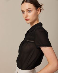The Black Lapel Lace Trim Pleated Blouse sold by rihoas