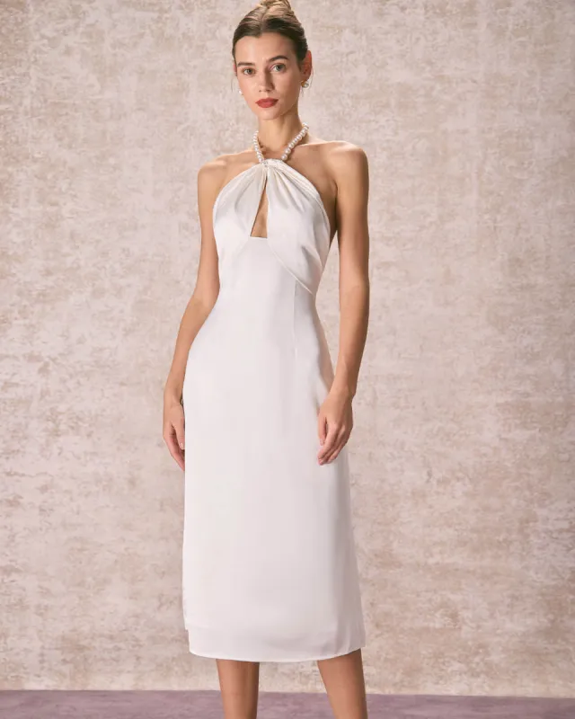 The Apricot Pearl Halter Satin Midi Dress sold by rihoas