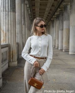 The White Lapel Pointelle Button Knit Top sold by rihoas