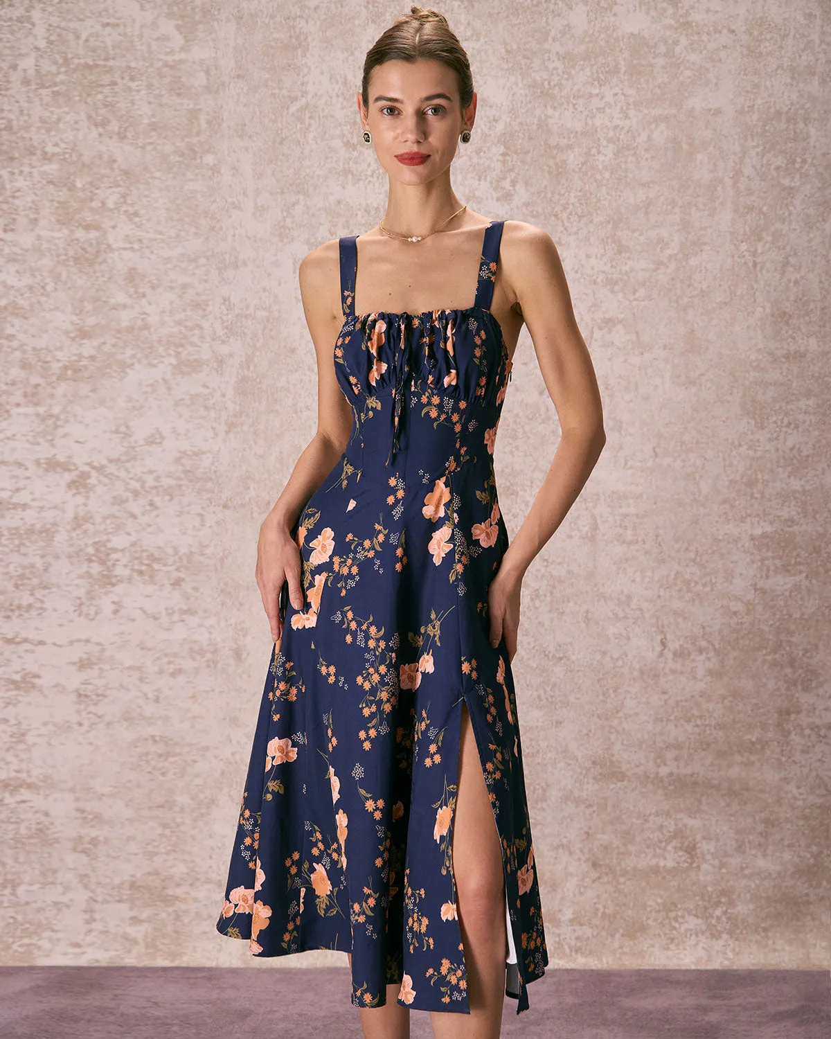 The Navy Lace Up Floral Ruched Midi Dress sold by rihoas