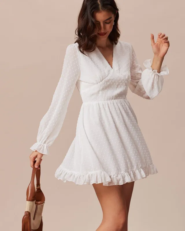 The White V Neck Ruffle Dobby Mesh Mini Dress sold by rihoas