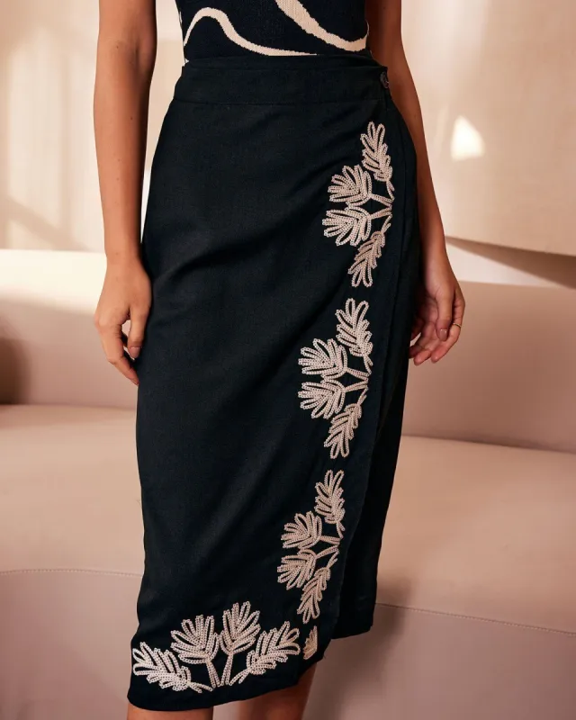 The Black Embroidery Button Wrap Midi Skirt sold by rihoas
