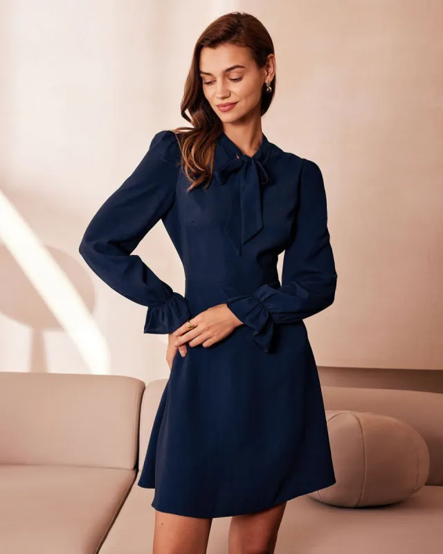 The Navy Mock Neck Ruffle Cutout Mini Dress sold by rihoas