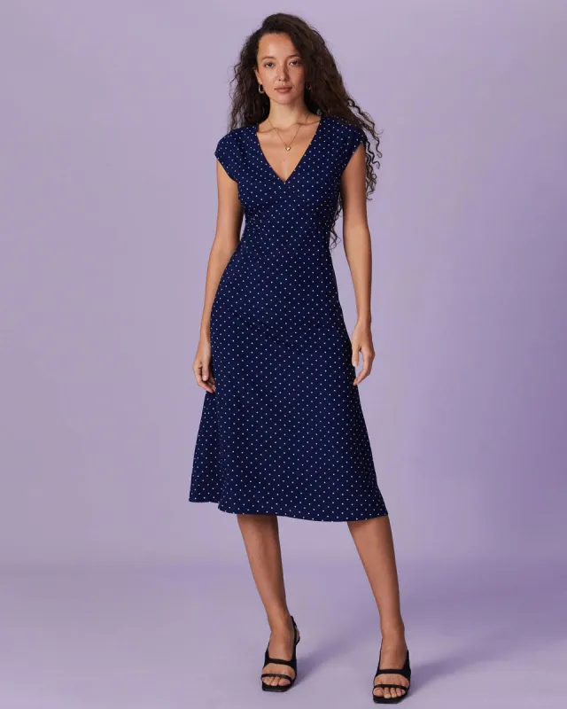 The Navy V Neck Polka Dot Ruched Midi Dress sold by rihoas