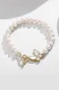Sparkly White Pearl Stretch Bracelet with Butterfly sold by Zapaka