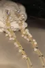 Golden Pearl Long Drop Earrings sold by Zapaka