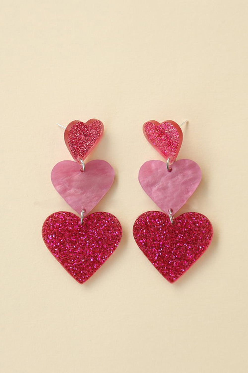 Fuchsia Sparkly Three Hearts Earrings sold by Zapaka