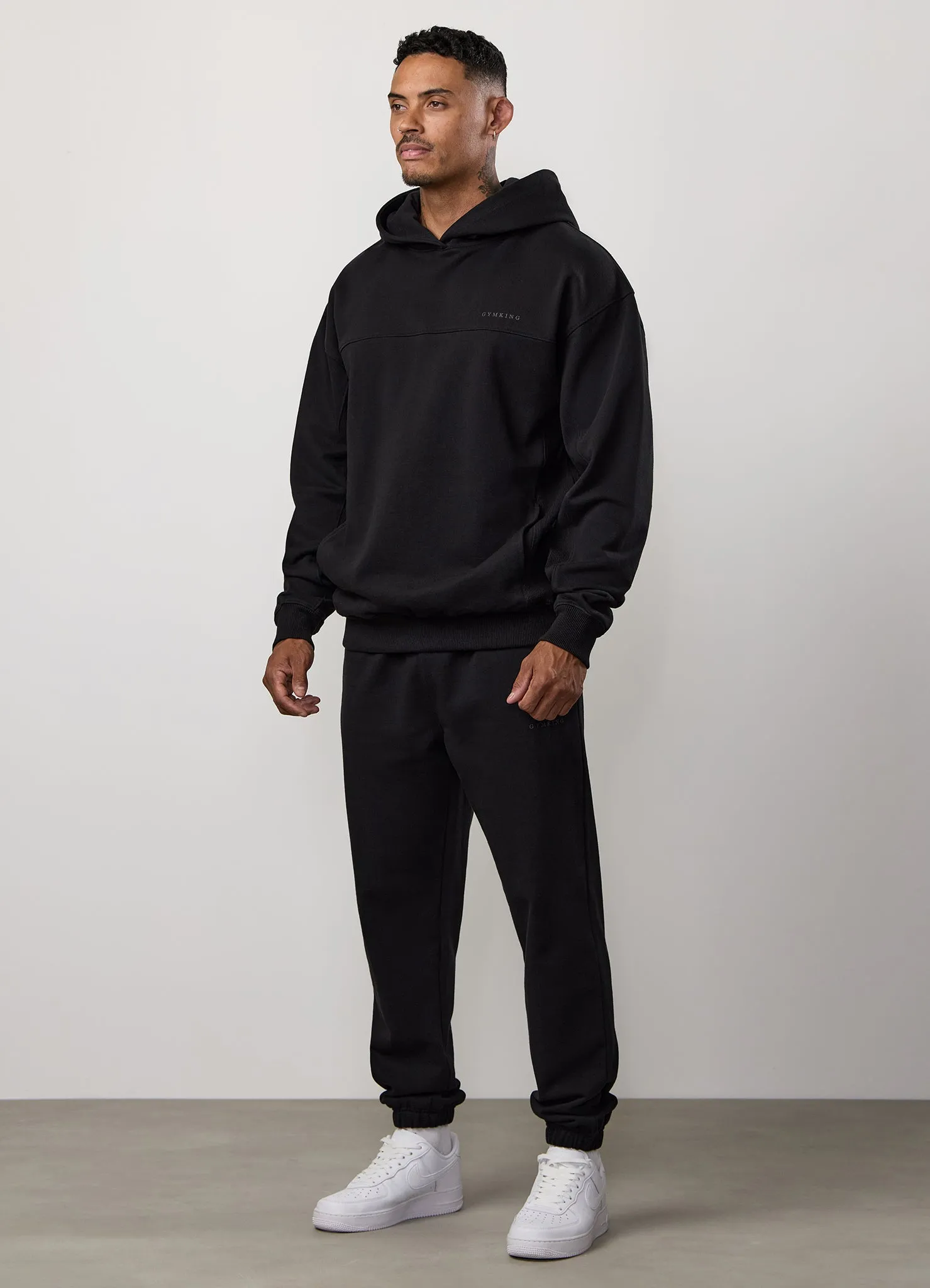 Gym King Linear Loopback Hood Tracksuit - Black sold by The Gym King