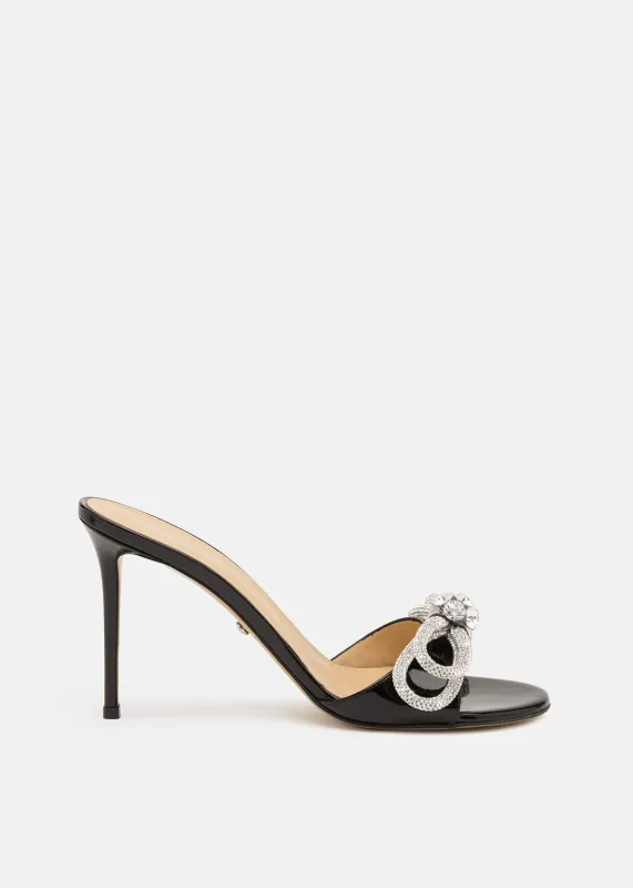 Double Bow Patent Mules sold by MACH & MACH