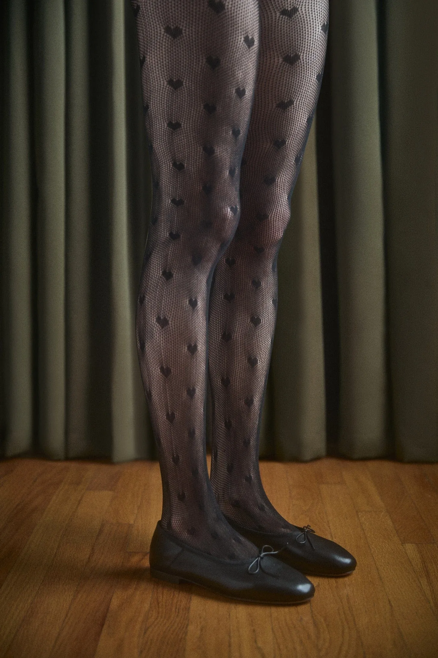 Sheer heart tights sold by Petit Moments