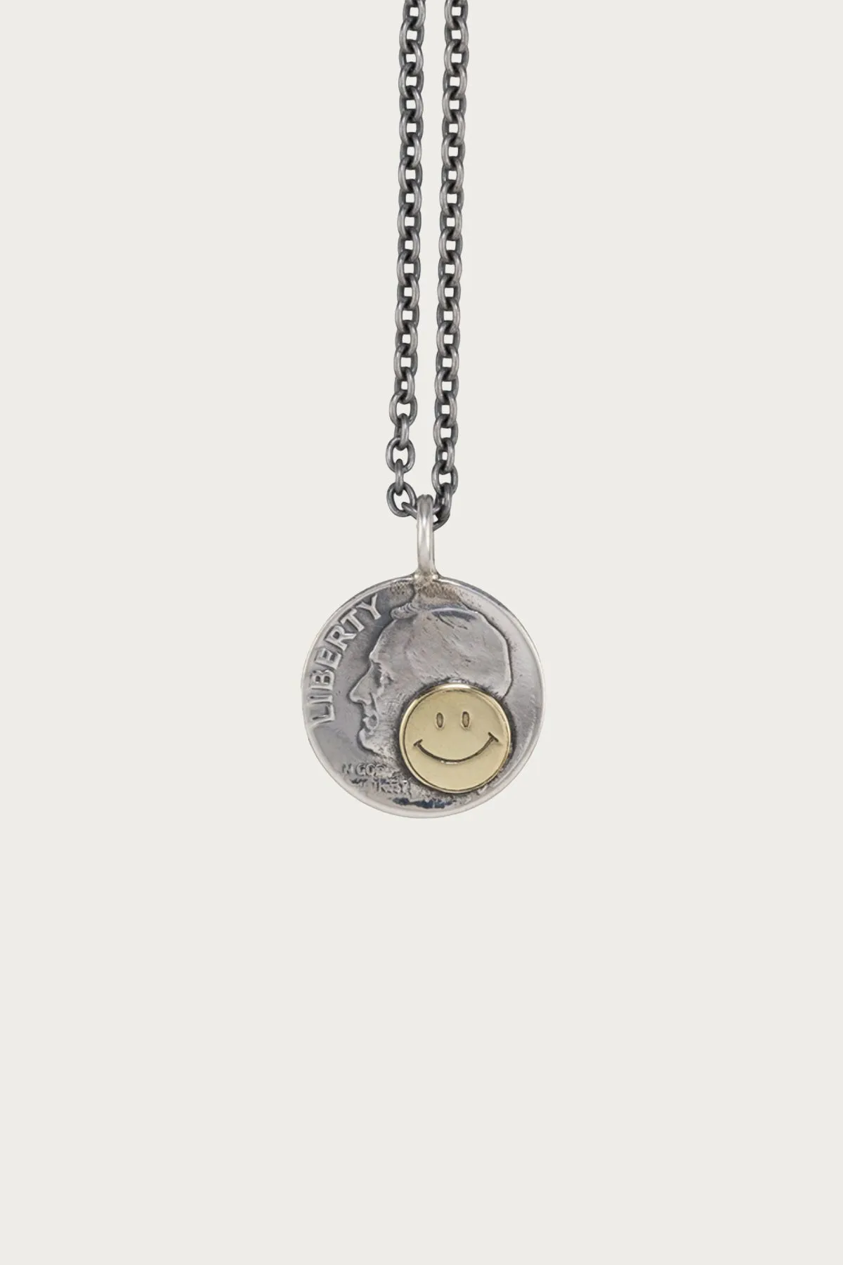 10¢ Brass Smile Pendant sold by Canoe Club