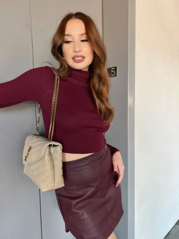 Wine Curved Faux Leather Mini Skirt sold by Velvet House