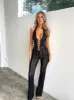 SAWYER JUMPSUIT BLACK BURNOUT sold by Outcast Clothing
