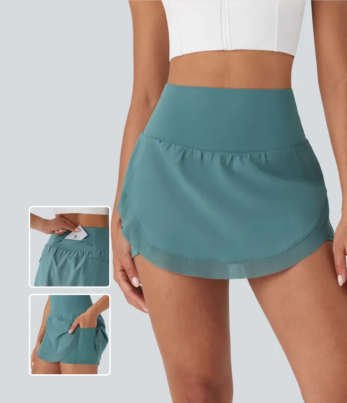 Halara Minifalda de yoga 2 en 1 de tiro alto con malla en contraste, dobladillo curvo y bolsillos - Mineral Blue - M sold by Halara