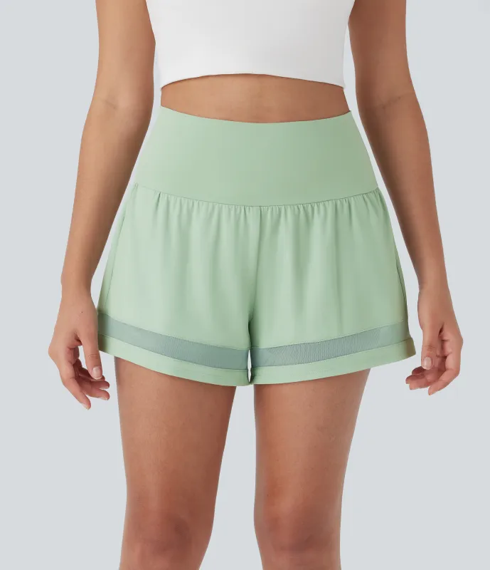 Halara Shorts de entrenamiento 2 en 1 Softlyzero™ Airy de tiro medio con contraste, bolsillos laterales y traseros de tacto fresco - Light Bean Green - XS sold by Halara