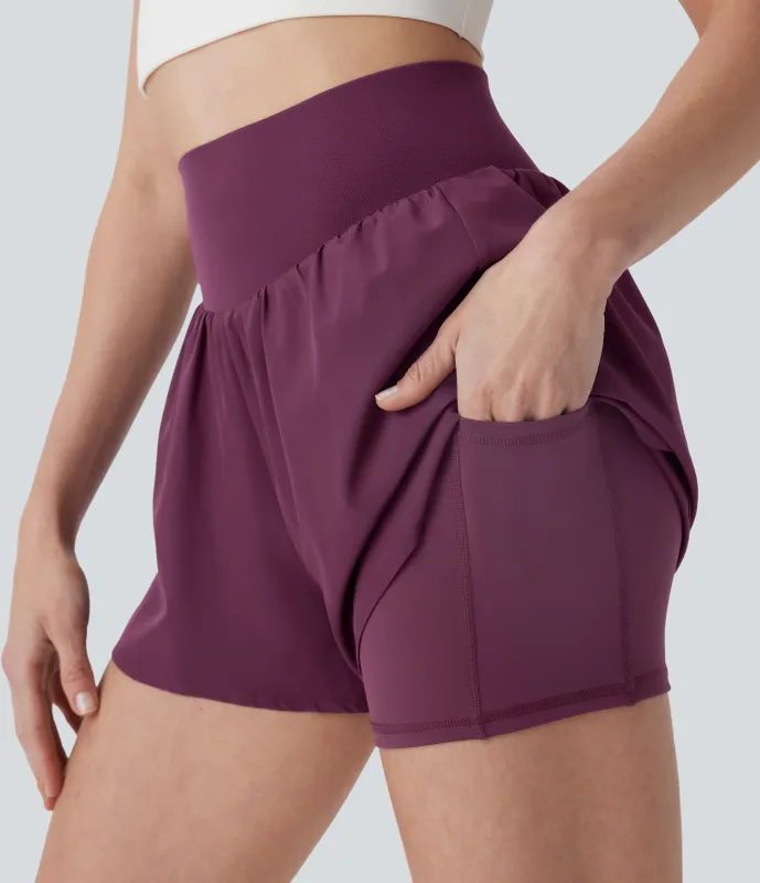 Halara Shorts de entrenamiento Breezeful™ 2 en 1 de tiro alto con secado rápido y bolsillos - Amaranth - XS sold by Halara