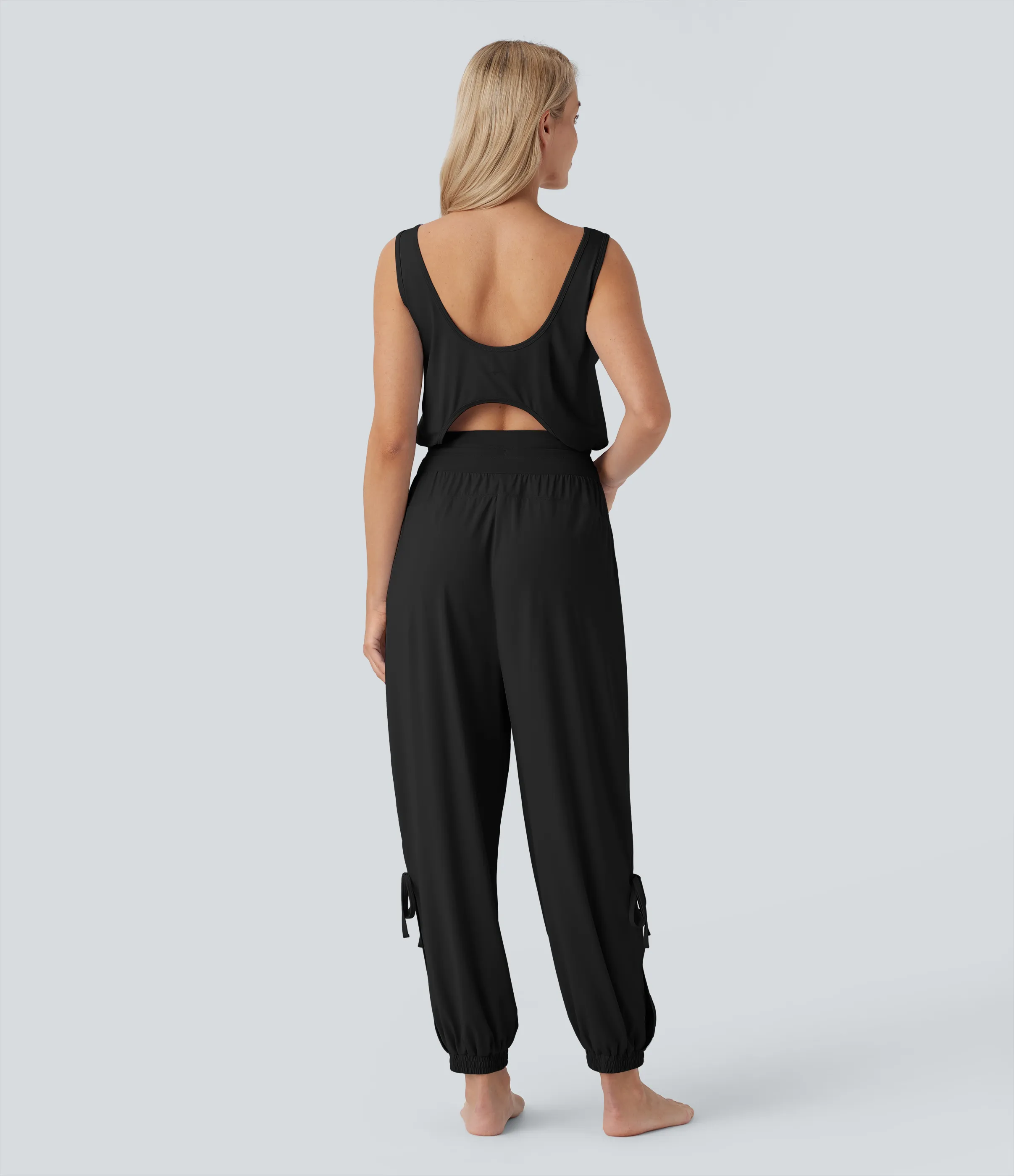 Halara Jumpsuit de yoga sin mangas con espalda descubierta, cordón ajustable y bolsillos laterales de tacto fresco - UPF50+ - Black - M(regular) sold by Halara product image thumbnail 2