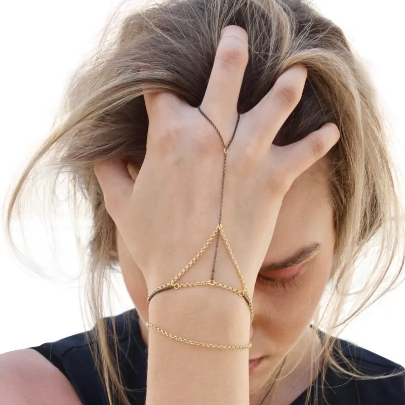 Silver + Gold Hand Chain sold by MHART