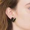 Vintage Black and Gold Flourish Trifari Earrings sold by Admiral Row