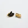 Vintage Black and Gold Flourish Trifari Earrings sold by Admiral Row