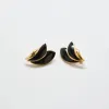 Vintage Black and Gold Flourish Trifari Earrings sold by Admiral Row