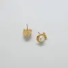 Vintage Tribal Gold and Pearl Stud Earrings sold by Admiral Row