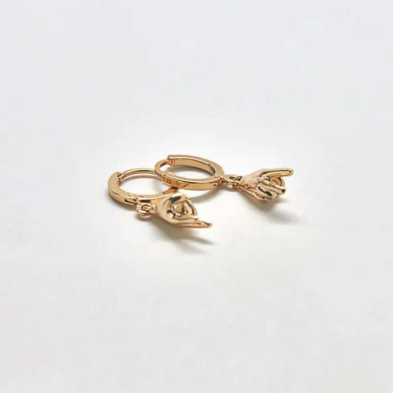 Gold Peace Huggie Earrings sold by Admiral Row