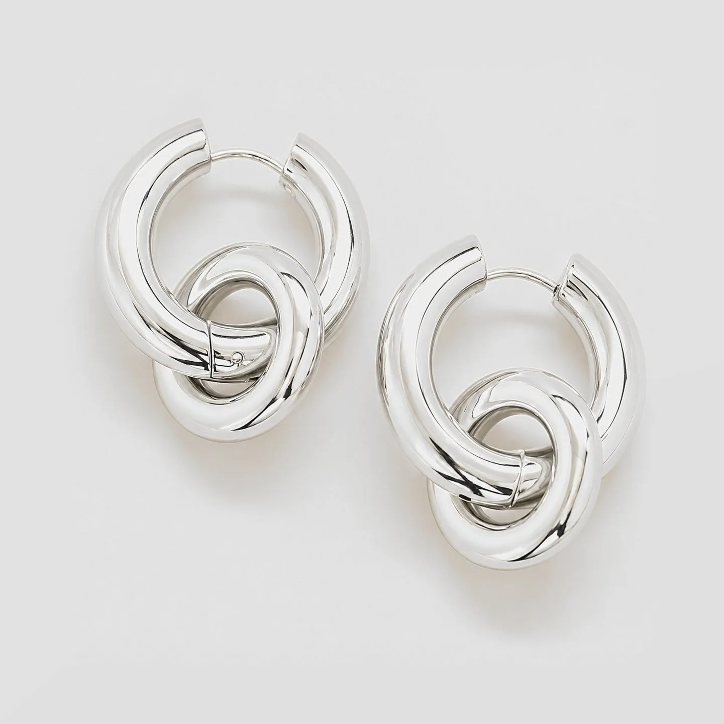 Silver Interlocking Hoop Earrings sold by Admiral Row