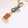 Cute Mini Hammer Bow Knot Leather Keychain sold by FloralTrip