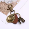 Retro Ancient Bronze Cowboy Hat Leather Keychain sold by FloralTrip