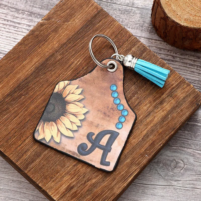 Western Style Sunflower&Letter Tassel Leather Keychain sold by FloralTrip