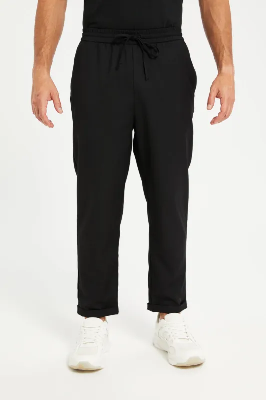 Men Black Solid Active Pants sold by Redtag