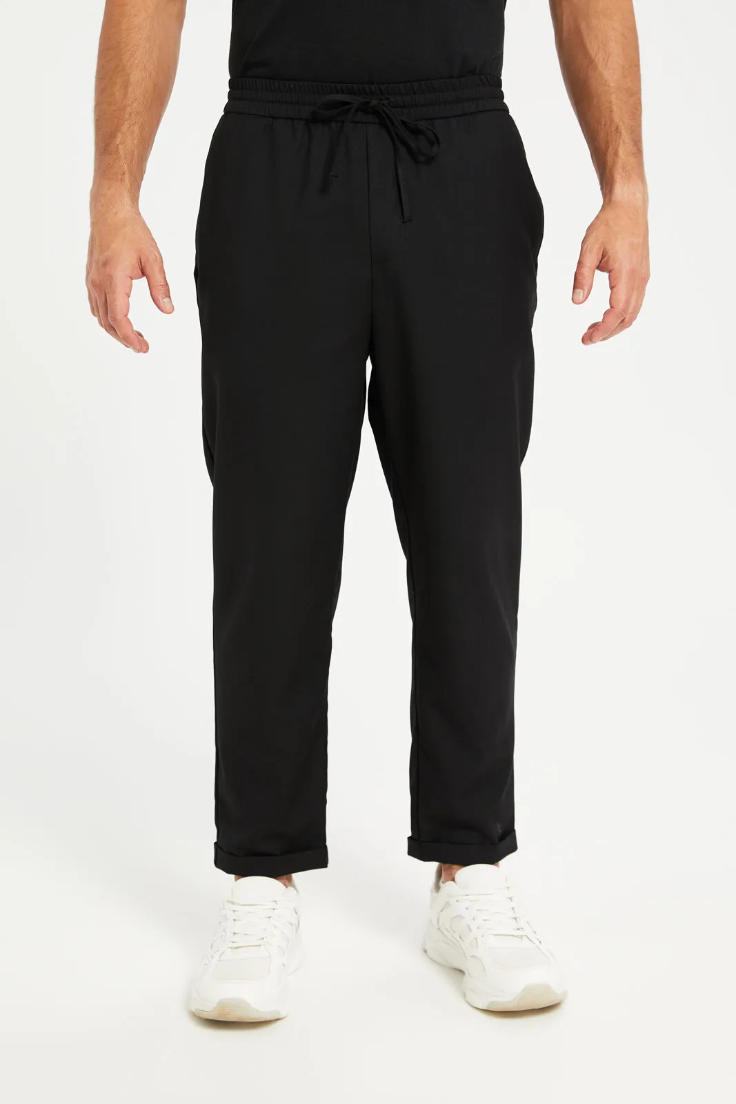 Men Black Solid Active Pants sold by Redtag