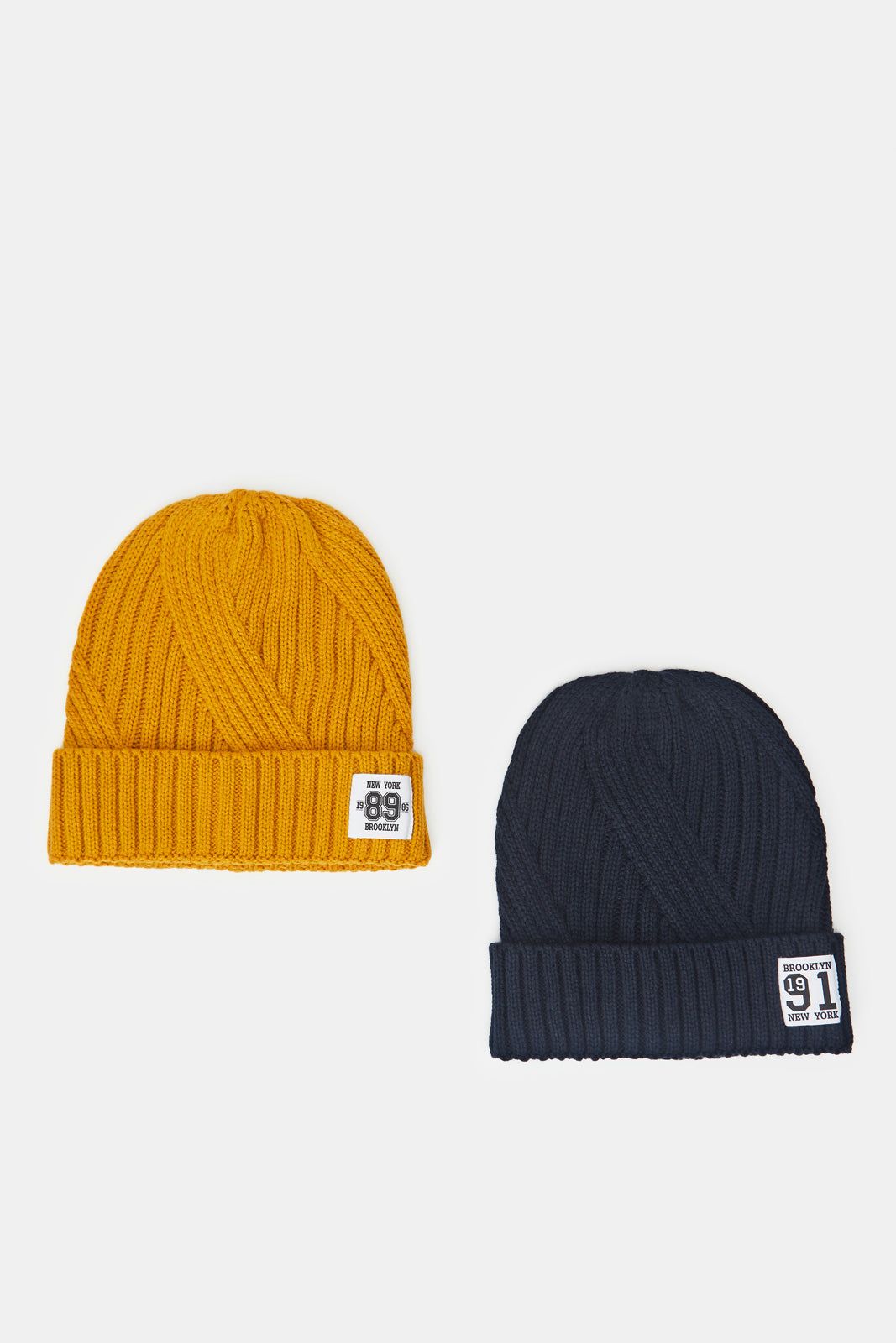 Men Navy And Mustard Knitted Cap Set (Pack of 2) sold by Redtag