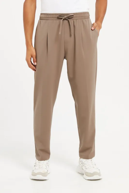 Men Beige Jogger Fit Trousers sold by Redtag