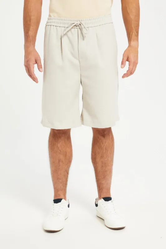 Men Beige Solid Bermuda Shorts sold by Redtag