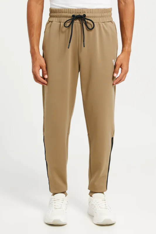 Men Beige Printed Soft Touch Joggers sold by Redtag