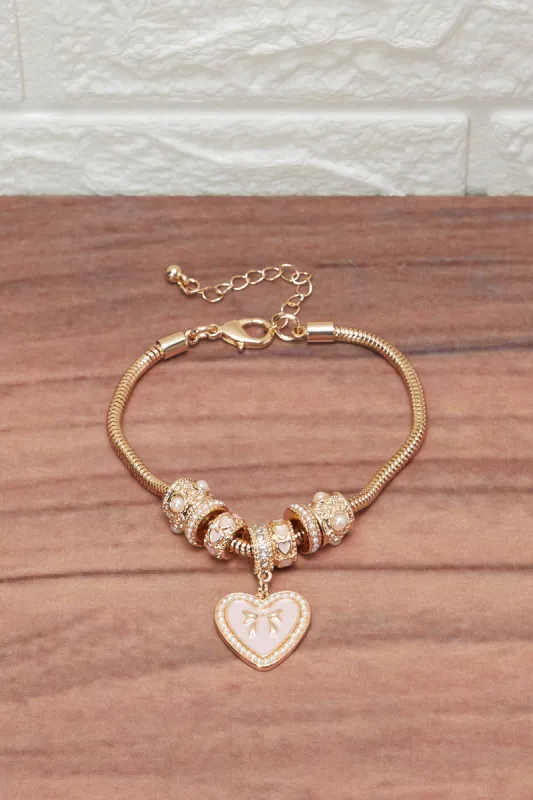 Women Gold Bracelet With Heart Charm sold by Redtag