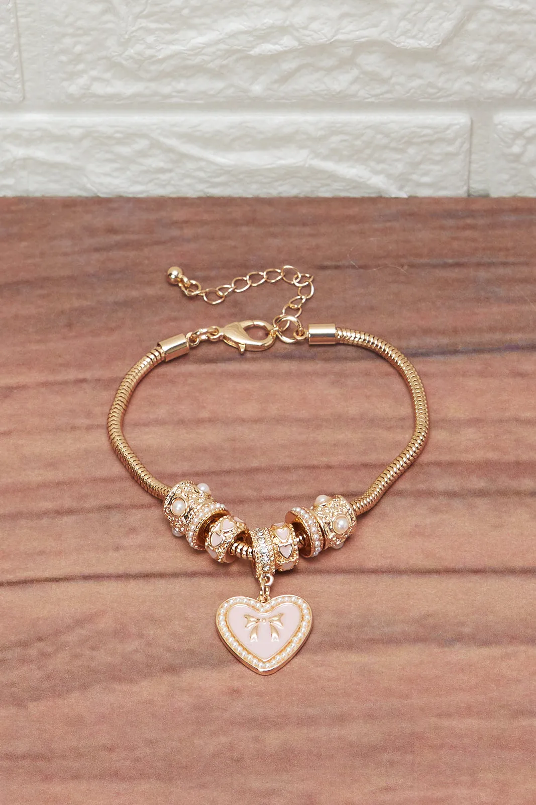 Women Gold Bracelet With Heart Charm sold by Redtag