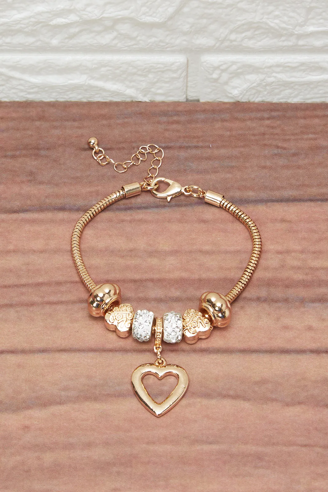 Women Gold Bracelet With Heart Charm sold by Redtag