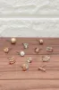 Women Gold Embellished Earring Set (12 Pairs) sold by Redtag