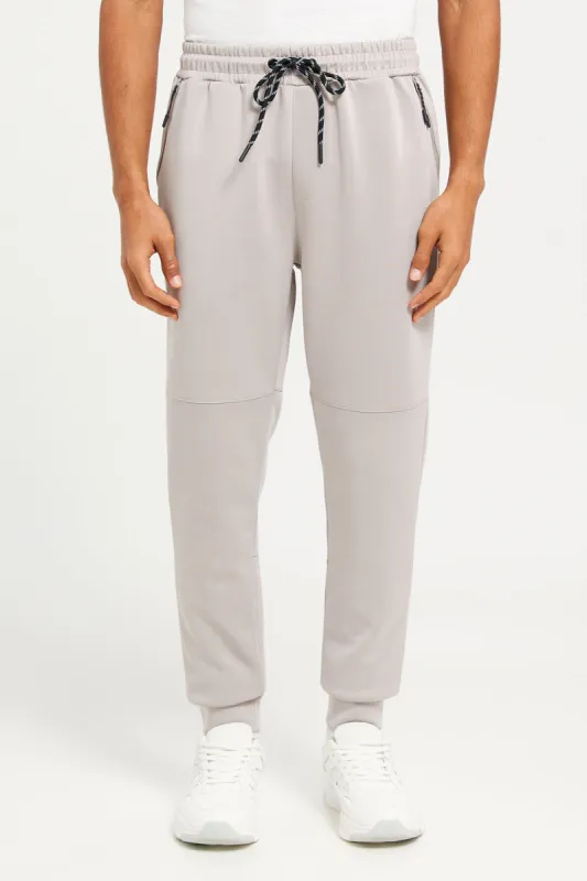 Men Beige Jogger Pants With Zip Pockets sold by Redtag