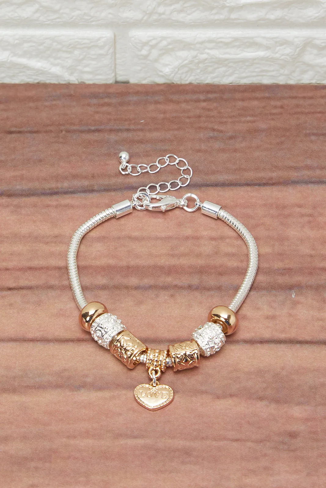 Women Gold Bracelet With Heart Charm sold by Redtag