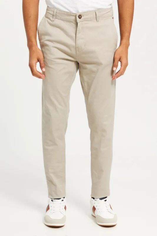 Men Beige Solid Chino Trousers sold by Redtag