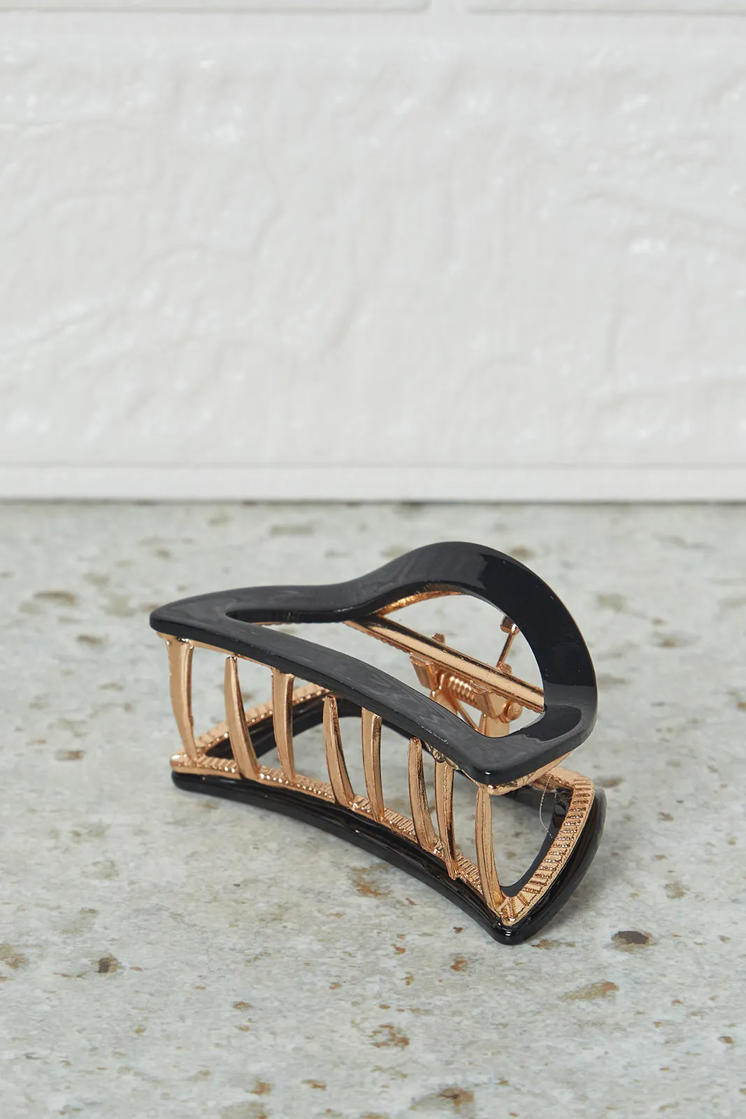 Women Black Hair Claw sold by Redtag