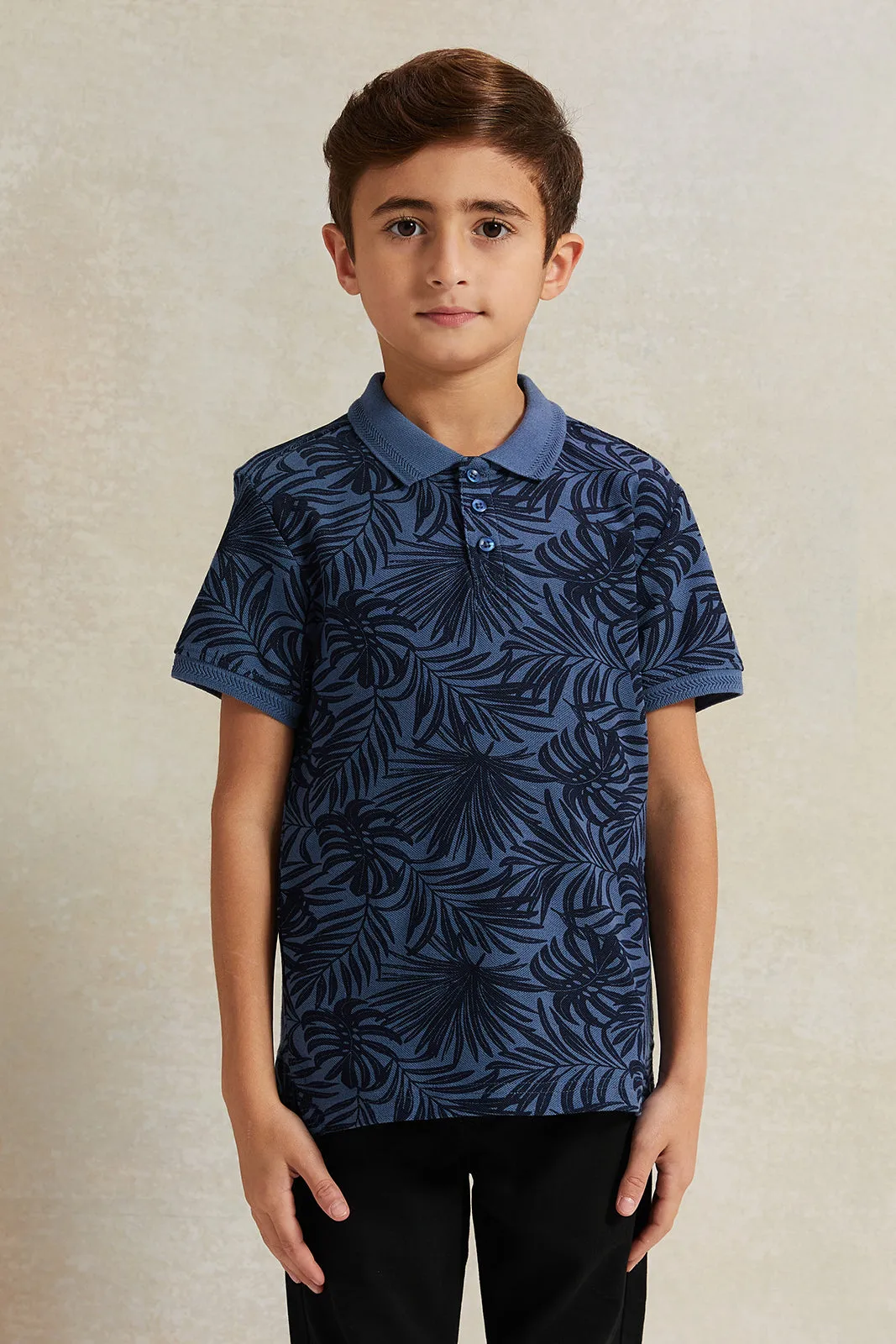 Boys Blue Pique Printed Polo Shirt sold by Redtag