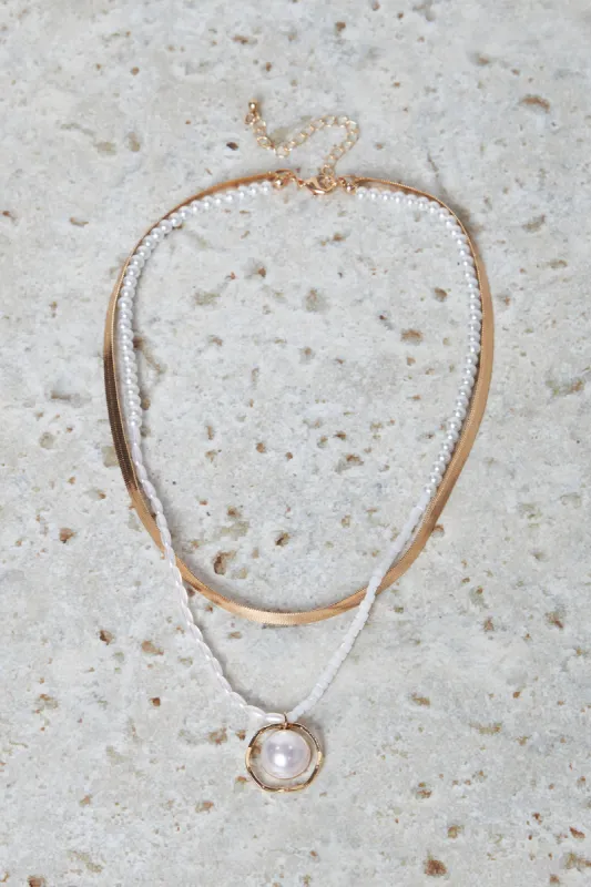 Women Gold And White Layered Embellished Necklace sold by Redtag