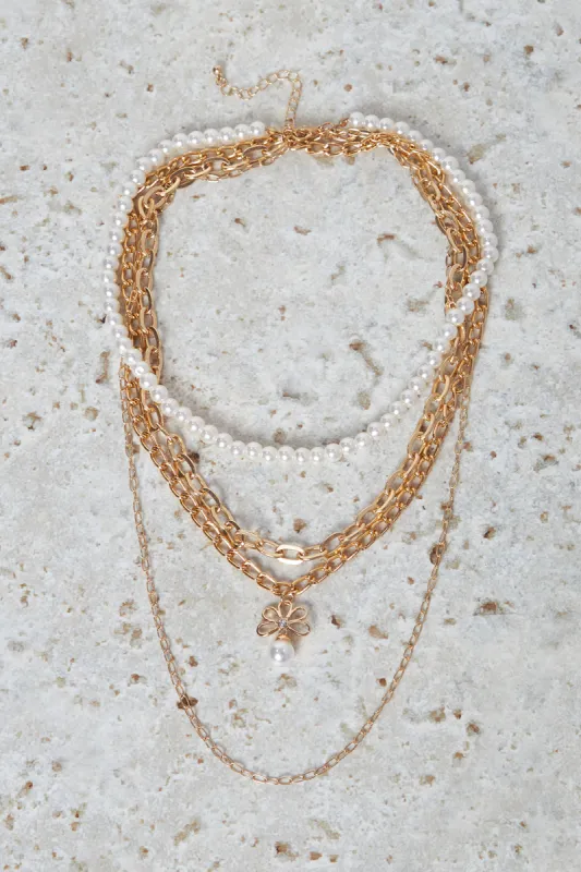 Women Gold Pearl Layered Embellished Necklace sold by Redtag