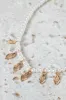 Women White And Gold Pearl Embellished Necklace sold by Redtag