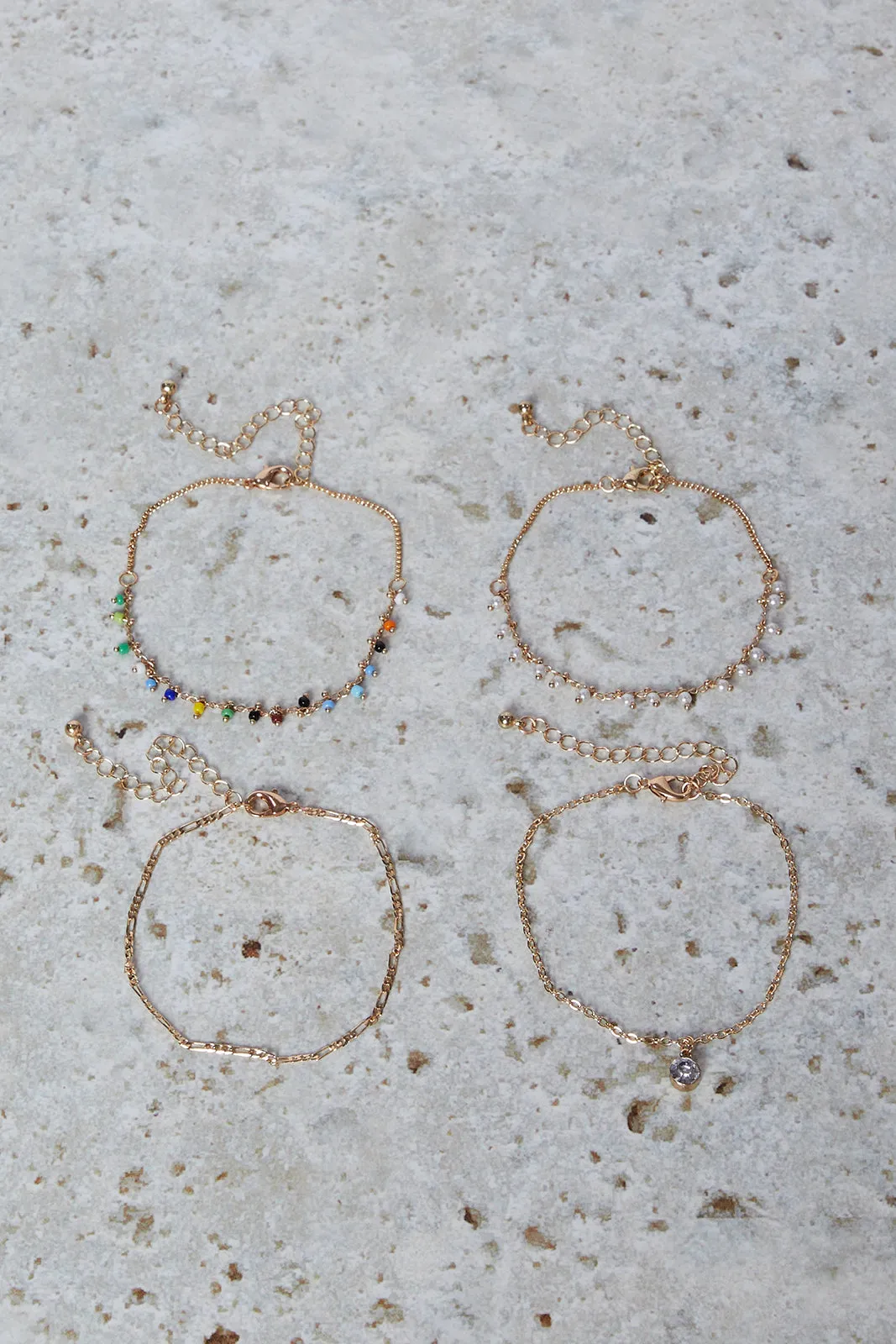 Women Gold Embellished Bracelet Set (4 Piece) sold by Redtag